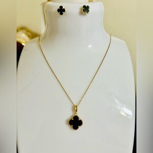Onyx Clover earrings and necklace in 18k gold setting.